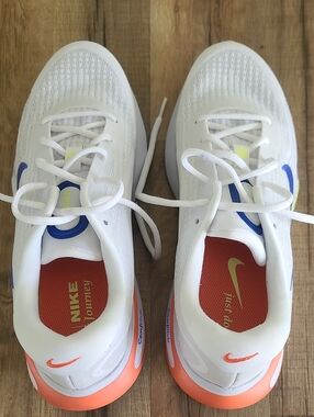 Nike White Sneakers with Orange Soles and Blue Swoosh